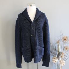 This beautiful cardigan Jacket features cotton chunky knit, deep navy blue colour, collared neck, cowichan style design, 2 front pockets, slouchy fitting and timeless minimalist design. It is in excellent vintage condition.  ✂------ M e a s u r e m e n t s -------- Measurements taken flat across the front | Double where needed (inch) * armpit to armpit : 20 * shoulder : 19 * sleeve : 25 * total length : 25 * tag size :  M (fits like L) ♥ Visit my shop https://www.etsy.com/ca/shop/Amilialia All the vintage goodies in my shop are carefully hand-picked by myself in CANADA. The quality of the garment will be checked thoroughly before listing. If there is any imperfection, it will be stated in the listing description. I love and take pride in all the clothes in my shop and I would like to share Knitted Cotton Button-up Outerwear, Winter Sweater With Shawl Collar And Pockets, Winter Shawl Collar Sweater With Pockets, Navy Cotton Winter Cardigan, Navy Cotton Cardigan For Winter, Cozy Blue Cardigan With Pockets, Navy Cotton Cardigan For Fall, Navy Cotton Polo Sweater For Winter, Cozy Navy Sweater For Winter