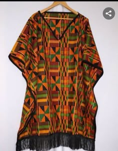 This mixed print blouse is made with best quality Ankara fabric and material. It is suitable for any kind of ceremony and outings. Multicolor Long Sleeve Tops With Traditional Patterns, Multicolor Short Sleeve Blouse With Geometric Pattern, Multicolor V-neck Top For Festivals, Traditional Multicolor Ankara Kaftan, Traditional Multicolor Patchwork Kaftan, Traditional Multicolor Ankara Fabric Kaftan, Bohemian Blouse With Traditional Patterns For Ceremonies, Traditional Multicolor Blouse With Patterns, Traditional Multicolor Blouse With Traditional Patterns