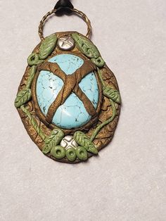 "Nature has taken ahold of this beautiful turquoise cabochon.  Perfect for green witch, warlock, tailsman, hobo, hippie, pagan Pendant measures 3\" tall x 2\" wide Signed on the back" Handmade Green Turquoise Bohemian Necklace, Handmade Hippie Turquoise Necklace, Artisan Green Turquoise Necklace With Large Pendant, Handmade Bohemian Green Turquoise Necklace, Bohemian Green Turquoise Necklace With Large Pendant, Bohemian Green Handmade Turquoise Necklace, Bohemian Green Turquoise Necklace, Artisan Green Turquoise Necklace With Patina, Bohemian Turquoise Cabochon Oval Pendant Necklace