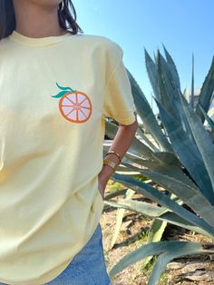 Our *EXCLUSIVE* Sunhoney Florida Orange Tshirt in Yellow is your new tee to bring on your next beach vacay! Add a pop of sunshine to your wardrobe with our Sunhoney Florida Orange Tshirt in a bright yellow. Made with high quality fabric, printed on Comfort Colors, this shirt will not only keep you stylish but also super comfy! Product is made to order: available for pick up/ships in 2-4 business days Content: 100% Cotton Fit: TTS - size up for oversized style Models wearing size: Medium Model si Yellow T-shirt For Spring Vacation, Casual Yellow T-shirt For Vacation, Yellow Crew Neck T-shirt For Beach, Fun Orange Summer Tops, Fun Summer T-shirt With Front Print, Cute Crew Neck T-shirt For Beach Season, Yellow Crew Neck Top For Beach Season, Crew Neck T-shirt With Screen Print For Day Out, Summer Orange Shirt For Day Out