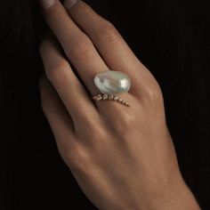 Description Mizuki's beautiful ring combining movement, diamonds and the luster of a white baroque pearl.Its striking and a conversation piece. 0.23CT Diamonds 14-karat Solid Yellow Gold Baroque Pearl Ring size 7 (other sizes need to pre-ordered) Please allow extra 7-10 days if ring resizing is needed Luxury Minimalist Pearl Ring, Luxury Minimalist Open Pearl Ring, Minimalist Luxury Pearl Drop Ring, Luxury Minimalist Midi Rings For Weddings, Luxury Elegant Pearl Ring For Everyday, Luxury Vintage Pearl Ring, Luxury Antique Pearl Ring, Luxury Timeless Open Midi Rings, Untraditional Engagement Rings Pearl