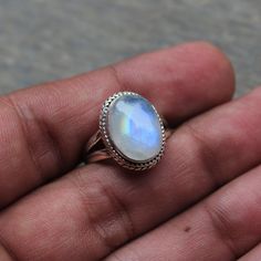 Gemstone - Natural Rainbow Moonstone Gemstone Size - 1x14 mm oval  Metal - Sterling Silver natural AAA rainbow moonstone set with a sterling silver handmade ring  Each Ring made with Precision and love, these rings are perfect for everyday use and a perfect accessory to wear at work.  Rings can be customized on request and gemstone can be switched to any other as per requirement.  Other beautiful designs uploaded with fabulous gemstones. kindly visit my store to view the complete collection.  Feel free to contact me for any queries regarding jewelry or for bulk order.  The ring will be gift wrapped in a premium handmade jewelry box Silver Celestial Oval Jewelry, Celestial Oval Gemstone Jewelry, Celestial Oval Jewelry With Natural Stones, Celestial Style Oval Jewelry With Natural Stones, Celestial Jewelry With Oval Natural Stones, Dainty Healing Rings, Mystical Oval Cabochon Jewelry, Silver Celestial Jewelry With Oval Cabochon, Celestial Oval Cabochon Rings