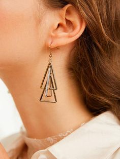 Sku CY-!24685 Material Alloy Feature Geometric Occasion Casual Type Earrings Accessories Color GOLD COLOR Size chart: Please consult the size chart we provide for this item's measurements to help you decide which size to buy. Please note: There may be 1-3cm differ due to manual measurement. Gold Dangle Hoop Earrings In Alloy, Trendy Triangle Gold Jewelry, Trendy Gold Triangle Jewelry, Trendy Triangular Gold Jewelry, Trendy Triangle-shaped Gold Jewelry, Trendy Gold Triangle Earrings, Gold Triangle Metal Jewelry, Gold Dangle Hoop Earrings, Triangle Gold Metal Earrings