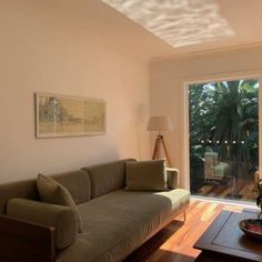 a living room filled with furniture and a sliding glass door