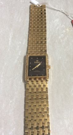 SUNBORN Men's Gold Watch, Rectangle Black Dial, Gold Round Indices Hour Markers, Water Resistant, on a Gold Stainless Steel Linked Band, Ready to be Cherishes & Enjoyed, for Years to Come! This is a Unused New/Old Stock Vintage Item, Ready to be Cherished & Enjoyed! This item will arrive in Perfect Working Condition, and would make an Awesome Gift for a Special Person! Measurements; Bezel/Case 1 3/8" x 1", Dial 1" x 3/4" Rectangle, Band Width 7/8" and fits a Standard 8" wrist perfectly. We Offer Free Sizing, if a Smaller Fit is Required, Just Contact us Prior to Purchasing, for Details Needed for the Sizing Process. We Ship Fast, the Next Business Day , for a Quick Delivery to you! May you have a Wonderful Time Shopping, Best Wishes! Gold Watch Men, Wristwatch Men, Special Person, Quick Delivery, Men's Watch, Wonderful Time, New Vintage, Vintage Watches, Gold Watch