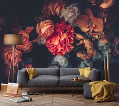 a living room with flowers painted on the wall