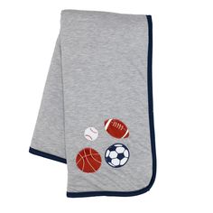 a gray towel with sports balls on it