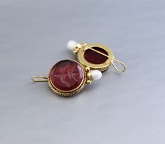 Description Gemstone - Red Glass Material - Brass Gemstone Size - 18 mm Earring Height Including Hoop - 4 cm Earring Width - 2 cm Finish - Smooth and high polished with brilliant shine. Note -The earrings are made to order, production day is about 3-5 working days. The one you receive may be slight different from the one in the picture due to handmade nature, but it will be almost same as in the above picture.These pieces are handcrafted from start to finish and have an imperfect handmade look.These earrings are the perfect addition to your collection. Our rings are meant to be classic enough for everyday wear or to give as a bridesmaid gift. You will receive the same piece as in the picture or identical. Since all gemstones are different from each other, I cannot guarantee that the gemsto Silver Jewlery, Bracelet Quotes, Edwardian Jewelry, Stamped Bracelet, Antique Diamond Rings, Jewelry Quotes, Earrings Antique, Antique Necklace, Art Deco Earrings