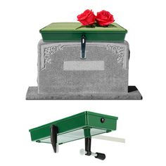 a green box with two red roses sitting on it's top and the bottom