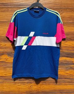 Adidas retro style T-shirt. Size fits M,L 90s Sports T-shirt For Summer, 90s Inspired Blue T-shirt With Letter Print, Vintage Multicolor Screen Print T-shirt, Vintage Pink T-shirt With Graphic Design, Sporty Pink T-shirt With Screen Print, 90s Style Short Sleeve Sports T-shirt, Retro Sports T-shirt With Graphic Print, Sporty Multicolor Color Block T-shirt, Color Block T-shirt For Sports In Summer