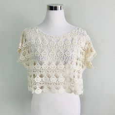 Short Sleeve Top Features A Scoop Neckline, Crochet Material, Boxy Fit And Scalloped Hem. (Undershirt Not Included) Fabric Content: 100% Cotton Size Scale: S/M - M/L Description: L: 14" B: " W: 21". Firm Price Short Sleeve Open Knit Crochet Top For Day Out, Cropped Lace Tops For Day Out, Summer Crochet Top With Crochet Trim, Summer Crochet Trim Short Sleeve Top, Chic Crochet Top For Beach With Crew Neck, Chic Crochet Top With Crew Neck For Beach, Summer Crew Neck Knit Top With Crochet Lace, Beige Crochet Top With Open Knit Short Sleeve, Chic Crew Neck Crochet Top For Beach