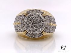 a gold and white ring with diamonds on it