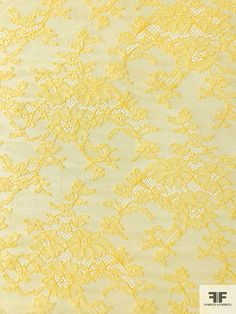 yellow lace fabric with small flowers and leaves on the bottom, as well as an image of