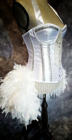 White Fitted Costume Corset, Fitted White Corset For Costume, White Boned Bodice Corset For Costume, White Overbust Corset For Costume Party, Glamorous White Corset With Boned Bodice, White Fitted Petticoat For Costume Party, Fitted White Petticoat For Costume Party, White Petticoat For Costume, White Cancan Petticoat For Costume Party