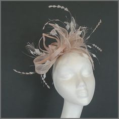 Gorgeous sinamay and feather fascinator. A beautifully delicate but impressive design in oyster and ivory colours using longer feathers for added drama! Made on a headband. Ideal headpiece for a special occasion such as weddings and race days. This design is available in other colours on request. All of our designs can be made to order in a range of different colours or styles, see our colour chart: https://jacquivaledesigns.co.uk/pages/sinamay-colour-chart Please contact us if you would like a Ladies Hats, Feather Fascinator, Fascinator Headband, Wedding Fascinators, Feather Fascinators, Derby Day, Colour Chart, Engagement Ideas, Grand National