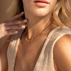 Our Herringbone Duo Chain Necklace is a showstopper that transforms any outfit in a statement ensemble. The bold Herringbone chain combined with the more dainty Box chain add dimension and interested, allowing for the necklace to be unique and minimalist at the same time. Finish/Material: 18K Gold Over Brass ∙ Rhodium Over Brass Featuring a layered necklace set with a ~3mm Herringbone Chain at 16 inches and a ~1mm Box Chain at 18 inches, adjustable with a 2 inch extension Part of the Golden Godd Caitlyn Minimalist, Aquamarine Stacking Ring, Duo Beads, Pearl Anklet, Diamond Huggies, Golden Goddess, Herringbone Chain, Art Deco Diamond Rings, Stacking Ring Set