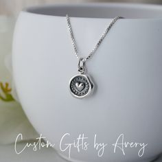 Always & Forever - this petite .925 sterling silver necklace makes a great Valentine's Day gift, bridal necklace, gift for mother/daughter, or a special someone in your life. This tiny wax seal heart dangles from an Italian made box or rolo chain. It is lightweight and prefect for everyday wear. Necklace comes ready for gifting in a jewelry box. Crafted out of recycled .925 sterling silver both the charm and chain are nickel-free. Dimensions:  Heart charm: 13mm long x 10mm wide Matching earrings Dainty Charm Necklace Gift, Valentine's Day Sterling Silver Initial Pendant Charm Necklace, Sterling Silver Heart Necklace With Initial Pendant, Anniversary Necklace With Sterling Silver Clasp And Round Pendant, Classic Sterling Silver Heart Necklace For Valentine's Day, Dainty Charm Necklace With Round Pendant For Anniversary, Dainty Round Pendant Charm Necklace For Anniversary, Stamped 925 Charm Pendant Necklace For Gift, Gift Charm Necklace With Stamped 925 Pendant