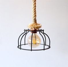 a light bulb hanging from a metal cage