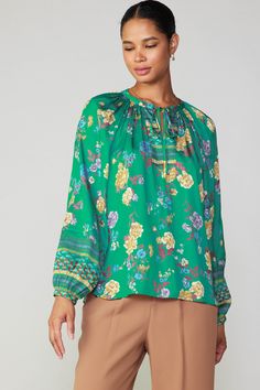 This split-neck blouse has a loose, flowing fit in a charming floral motif accented by an intricate border print. Tie up the neckline or leave it loose for a more casual feel. •Split neckline with self-tie •Gathered detailing •Long sleeves •Slim button cuffs •Relaxed fit item number 2330147 Green Long Sleeve Tops With Floral Print, Green V-neck Blouse With Blouson Sleeves, Green V-neck Tops With Blouson Sleeves, Elegant Flowy Green Blouse, Elegant Green Flowy Top, Elegant Flowy Green Top, Green Printed Long Sleeve Blouse, Elegant Floral Print Top With Split Neck, Green Blouse With Blouson Sleeves For Spring