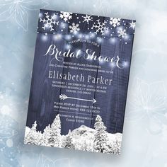 an elegant winter bridal shower party with snowflakes and lights on the wood