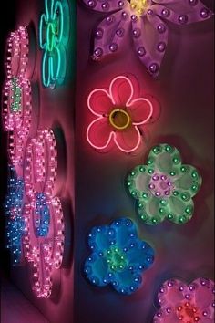 colorful lights and flowers are on the wall