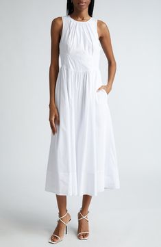 A set-in waist softly structures an otherwise totally laid-back dress cut from a crisp and cool cotton blend. 50" length (size 8) Back keyhole with tie closure Jewel neck Sleeveless Partially lined 68% cotton, 28% nylon, 4% spandex Dry clean or machine wash, tumble dry Imported