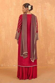 Ruby red full sleeves A-line kurta with Mughlai bloom embroidery using sequin-pearl highlights. Paired with a flared palazzo and a border embroidered taupe brown dupatta. - Aza Fashions Embroidered Anarkali Palazzo Set With Long Sleeves, Georgette Palazzo Set With Sheer Dupatta And Long Sleeves, Long Sleeve Georgette Palazzo Set With Sheer Dupatta, Transitional Long Sleeve Georgette Palazzo Set, Embroidered Long Sleeve Palazzo Set For Diwali, Elegant Red Anarkali Set With Long Sleeves, Festive Embroidered Long Sleeve Palazzo Set, Elegant Red Long-sleeved Anarkali Set, Elegant Red Long Sleeve Anarkali Set