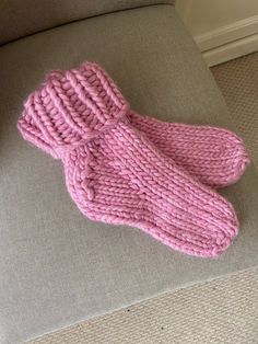 The Super Chunky Cosy Sock is a Pdf knitting pattern that knits up a pair of lovely thick, warm socks. Knitted in stockinette stitch in the round from the toe up, ending with a folded-down rib cuff. They can be made oversized to create a slipper sock and worn over a thinner pair of socks (my favourite way to wear them!) for extra cosy feet. Happy knitting! Cozy Knitted Yarn Socks, Cozy Hand Knitted Yarn Socks, Cozy Hand-knitted Yarn Socks, Cozy Hand Knitted Socks, Cozy Chunky Knit Socks With Round Toe, Cozy Chunky Knit Socks, Cozy Snug Hand Knitted Pattern, Comfortable Hand Knitted Pink Socks, Hand Knitted Pink Socks For Winter