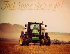 a tractor in a field with the words, just cause she's a girl