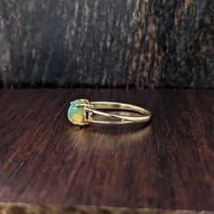 This lovely opal has all the colors of the rainbow. This glowing oval ring is perfect for the modern bride or that special someone in your life! This opal ring also makes a beautiful October birthstone gift for your loved ones! This ring is made with solid 14K Gold. Ethiopian Opal Oval Ring For Wedding, Opal Oval Cabochon Ring For Promises, Opal Oval Cabochon Promise Ring, Oval Cabochon Opal Promise Ring, Yellow Gold Oval Solitaire Opal Ring, Oval Solitaire Opal Ring In Yellow Gold, Classic Ethiopian Opal Gemstone Rings, Adjustable 14k Gold Oval Opal Ring, Adjustable Oval Opal Ring In 14k Gold