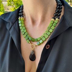 Canadian jade and black onyx layered necklace with pendant. Chunky statement natural gemstone beaded necklace for women. Large green black handmade necklace with big bead and gemstone. Big bold bohemian bright necklace in gold color are suitable for an casual look, evening look and for a holiday. These necklace will be a good Christmas, anniversary, wedding or birthday gift for women, mom, wife, girlfriend, sister or daughter. Women's necklace with natural stone. It emphasizes the beauty of your Elegant Black Jade Jewelry, Black Jade Round Beads Jewelry, Black Jade Jewelry With Round Beads, Black Jade Jewelry With Natural Stones, Handmade Black Jade Necklace, Green Onyx Necklace For Gift, Green Onyx Necklace For Gifts, Green Onyx Necklaces Perfect As Gifts, Green Onyx Necklace Gift