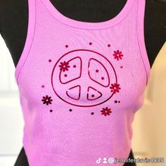 Purple/Pink Peace Sign With Stars And Flowers That Are Metallic, It Runs A Size Large. However, It Fits A Little Closer To A Medium. It's Brand New From My. Boutique With Zero Damage Pink Peace Sign, Stars And Flowers, Sparkly Crop Tops, White Cami, Floral Tee, Yellow Plaid, Blue Tee, Floral Crop Tops, Knit Crop Top