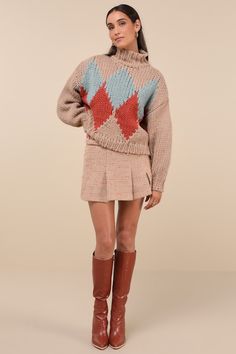 As the snow falls, cozy up in the Little Lies Cabin Cuteness Taupe Multi Diamond Pattern Pullover Sweater! Chunky, cotton-blend knit shapes a darling, multicolored diamond pattern, framed by long sleeves with drop shoulders and fitted cuffs. Relaxed bodice has a mock neckline and a lightly cropped hem. Ribbed knit at neckline, cuffs, and hem. Fit: This garment fits true to size. Length: Size small/medium measures 21" from shoulder to hem. Bust: Great for any cup size. Waist: Not Fitted - comfortable room throughout midsection. Undergarments: May be worn with any standard bra. Fabric: Fabric is very stretchy. Unlined. 65% Cotton, 35% Viscose. Cold Water Wash With Similar Colours. Do Not Bleach. Dry Cleanable. Do Not Tumble Dry. Imported. Lulus | Cabin Cuteness Taupe Multi Diamond Pattern Pu Cozy Long Sleeve Argyle Sweater, Cozy Argyle Pattern Long Sleeve Sweater, Winter Argyle Pattern Tops, Winter Cotton Argyle Sweater, Winter Argyle Knit Sweater, Knit Sweater With Argyle Pattern And Long Sleeves, Snow Falls, Sweater Chunky, Mock Neckline