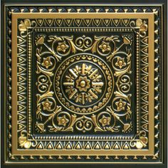 an intricately designed ceiling tile in gold and black with ornate designs on the center