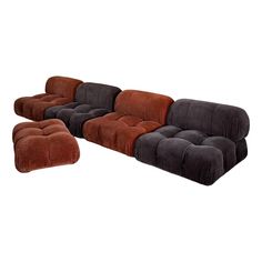 a large sectional couch and footstool in various colors