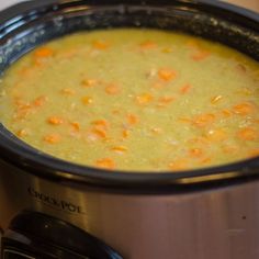 a pot filled with soup sitting on top of a stove