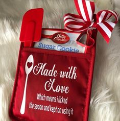 a red bag with some candy in it on a white furnishing area next to a spoon and fork