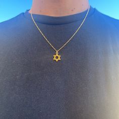 "A beautiful and dainty Goldfilled Star of David Necklace.  The chain is goldfield and the Star of David is Gold plated with high-quality 2-micron gold. The Star of David (also known as \"Magen David\" or \"Shield of David\") is an ancient Jewish symbol that is known from the holy bible and known as a symbol for self-protection. A beautiful piece to add to your personal collection or to give as a special gift. ❤𝗠𝗘𝗔𝗦𝗨𝗥𝗘𝗠𝗘𝗡𝗧𝗦 ❤ Pendant length: 0.47\" / 1.2 cm Pendant with: 0.47\" / 1.2 Gold Star Of David Charm Necklace With Delicate Chain, Dainty Star Of David Necklace With Adjustable Chain, Gold Star Of David Charm Necklace As Gift, Gold Star Of David Charm Necklace For Gift, Gold Star Of David Spiritual Necklace, Gift Delicate Chain Necklace With Star Of David Pendant, Star Of David Tarnish Resistant Necklace Gift, Gold Star Of David Necklace Gift, Gold Star Of David Necklace For Gift