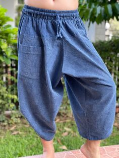 "Male Model Tall 5'9\" Waist 34\" Samurai Pants - elastic waistband and cuffs - Fits all! Unisex pants These beautiful casual pants are unique & comfortable to wear Handmade with a very lovely pattern, it is easy to wear and great for many occasions. One size fits most. These pants are great for many different activities like traveling, dancing, going to festivals, rock climbing, yoga, meditation, massage, working out, martial arts, Taichi MATERIAL: 100% Cotton APPROX MEASUREMENT: Waist: 24\ Baggy Wide Leg Harem Pants With Pull-on Style, Baggy Capri Pants With Pockets, Casual Harem Bottoms With Elastic Waistband, Casual Harem Pants For Yoga In Spring, Casual Spring Harem Pants For Yoga, Summer Baggy Capri Length Pants, Casual Harem Yoga Pants, Casual Harem Pants, Baggy Straight Capris With Elastic Waistband