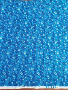 a blue background with white stars and bubbles