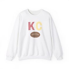 Show off your Kansas City Chiefs pride with our stylish patchwork-inspired crewneck! This unique sweatshirt features a football graphic and a handcrafted look that's perfect for game days or casual outings. Though it looks handmade, it's expertly crafted for durability and comfort. .: Made with a medium-heavy fabric blend of 50% cotton and 50% polyester, this sweatshirt feels cozy and is the perfect choice for those colder months. .: The classic fit and crew neckline deliver a comfy wearing expe Chiefs Crewneck, Game Day Sweatshirt, Chiefs Shirts, Unique Sweatshirt, Football Design, Kansas City Chiefs, Cut And Style, Game Day, Kansas City