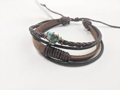 Turquoise bracelet, boho style leather unisex bracelet, couples gift, great for boyfriend and girlfriend, husband, wife honeymoon gift, etc. Adjustable size to fit approx 6.5 to 8.5 inches. Genuine African turquoise is affordable, yet quality stone. We've had great feedback on these natural boho feel, rustic style bracelets. An excellent complement for nearly any outfit. Looks great with everything from a flannel shirt on him; to a boho summer dress on her. This design works well stacked with ou Adjustable Brown Wrap Bracelet For Beach, Bohemian Brown Bracelet With Sliding Knot, Bohemian Turquoise Leather Bracelet As Gift, Handmade Trendy Brown Wrap Bracelet, Bohemian Brown Leather Bracelet Hand Wrapped, Trendy Handmade Brown Wrap Bracelet, Bohemian Hand Wrapped Brown Leather Bracelet, Hippie Brown Leather Festival Bracelet, Handmade Adjustable Turquoise Leather Bracelet