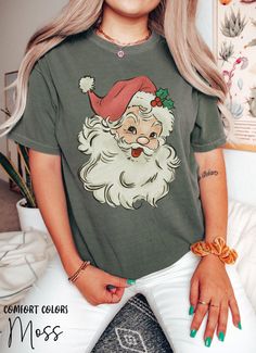 Merry Christmas Santa Shirts For Women, Retro Santa T-Shirt, Groovy Holiday Winter Christmas Snowman Tshirt, Vintage Xmas Comfort Colors Tee HOW TO ORDER ➀ Select color ➁ Select the size (Please check size chart) ✦ True to size. Size up 1-2 sizes for an oversized look. ➂ Add to cart ✦ (Optional) "Add message to Seller" on the checkout page. GARMENT FEATURES ✦ Crew neckline ✦ Direct to garment printing - no vinyl, decal, or iron-on technique ✦ Our designs are printed on the garment to last a long time and may not appear as 'glossy' or saturated as iron-on designs are. ✦ Please note that colors may appear different on different digital screens and may not be a true representation of the actual colors. ✦ Additional T-Shirt Colors and Sizes Available Upon Request ✧✧Brands: Bella Canvas Unisex Christmas Graphic Print Short Sleeve T-shirt, Christmas Funny Print Short Sleeve T-shirt, Funny Print Christmas T-shirt, Green Crew Neck Christmas Shirt, Christmas Holiday Graphic Print T-shirt, Christmas Graphic Print T-shirt, Christmas Letter Print Crew Neck T-shirt, Christmas Graphic Tee With Short Sleeves, Holiday Crew Neck Pre-shrunk Top