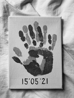 a black and white photo of a handprint with the number 1501 on it