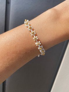 White Daisy Flower Bracelet | Beaded Bracelet | Daisy Flower Bracelet | Daisy with Gold Details Daisy Flower Jewelry, White Dainty Flower Shaped Beaded Bracelets, Delicate White Flower Beaded Bracelets, Delicate White Flower Shaped Beaded Bracelets, White Dainty Beaded Bracelet With Flower Charm, Dainty White Beaded Bracelet With Flower Charm, White Flower-shaped Bracelet With Tiny Beads, Adjustable White Bracelet With Flower Decoration, Delicate White Flower Bracelets