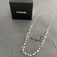 This Necklace Is Gently Used And Comes In Its Original Box. Timeless And Classic, Can Be Worn With Many Tops! White Chain Jewelry For Formal Occasions, Luxury White Necklace With Chain Detail, Designer White Jewelry For Everyday Luxury, Designer White Jewelry For Everyday Wear, Designer White Necklaces For Gifts, Designer Round White Gold Necklace, Designer White Gold Round Necklace, Chanel N 5, Chanel N° 5