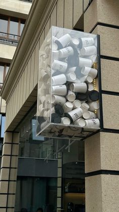 a box filled with cups sitting on top of a building