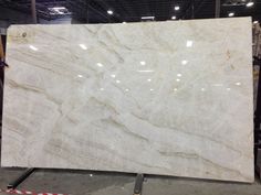 a large white marble slab in a warehouse