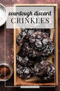 a wooden box filled with chocolate cookies on top of a table