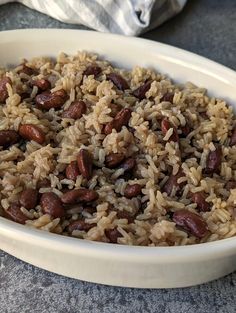 a bowl filled with rice and beans on top of a table